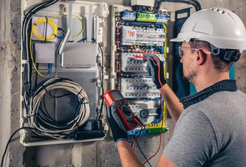 man-electrical-technician-working-switchboard-with-fuses_169016-24062 man-electrical-technician-working-switchboard-with-fuses_169016-24062