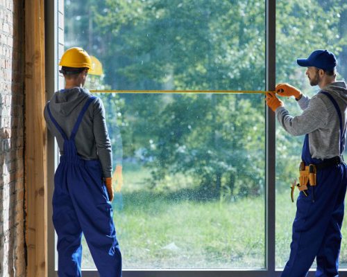 two-young-male-builders-wearing-blue-overalls-using-measuring-tape_386167-4779 two-young-male-builders-wearing-blue-overalls-using-measuring-tape_386167-4779